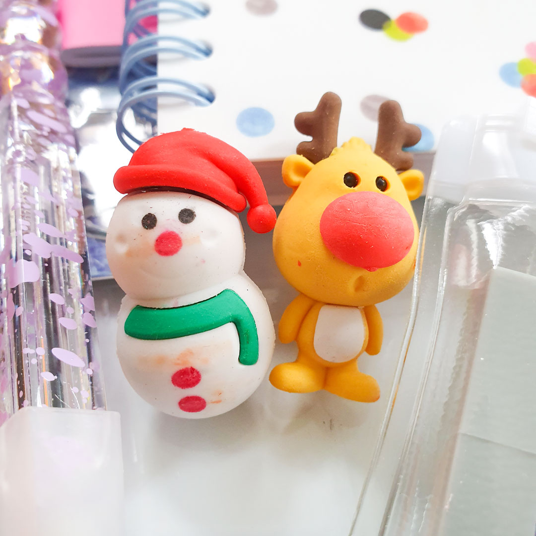 Snowman and reindeer erasers. 